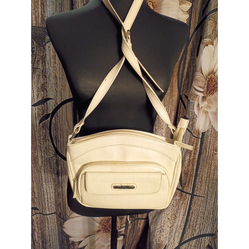 Jaclyn Smith crossbody bag features a textured faux crocodile leather design